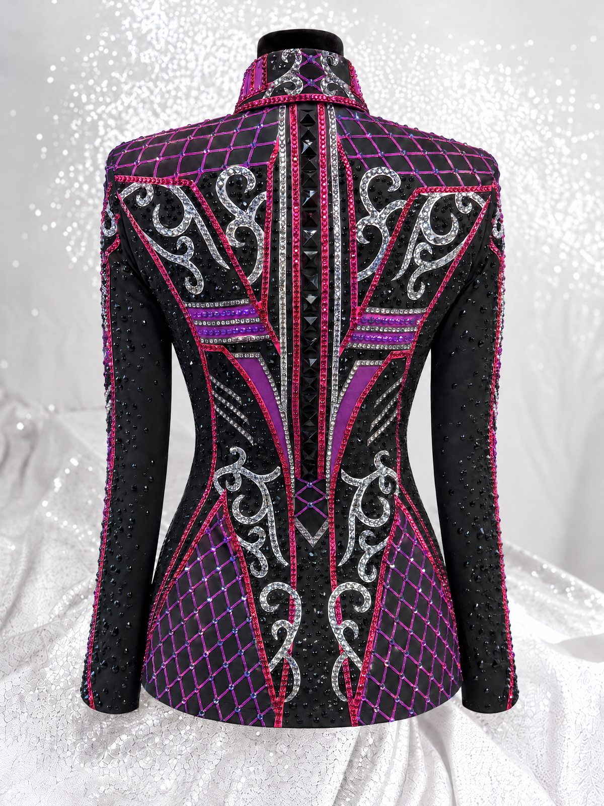 Back view of a black showmanship jacket with pink, magenta, and silver embellishment; Item 1538