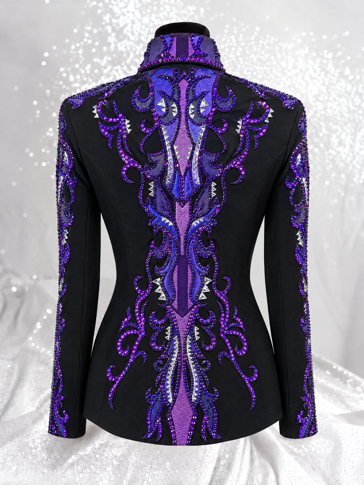 Back view of a black showmanship jacket with purple embellished panels; Item 1005