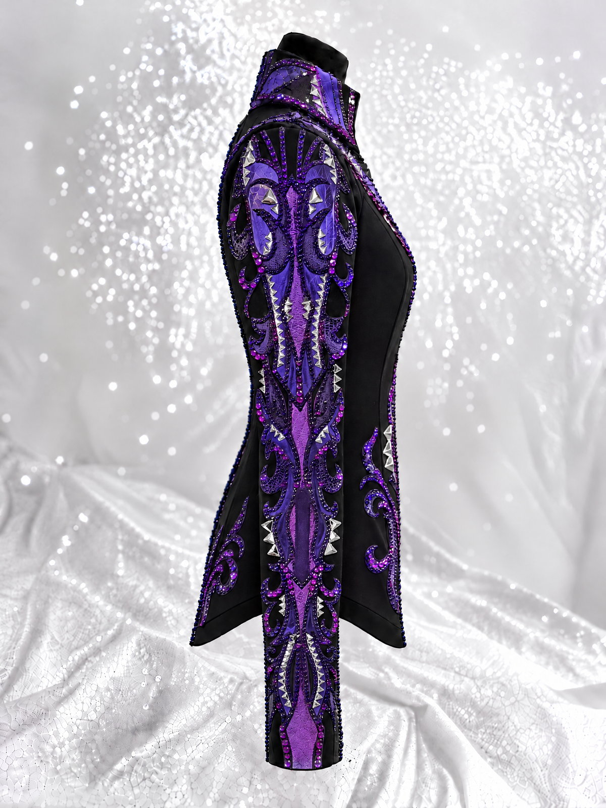 Side view of a black showmanship jacket with purple embellishment; Item 1005